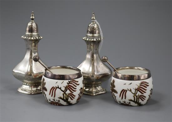 A pair of George V silver pepper pots, J.B. Chatterly & Sons Ltd, Birmingham, 1911 and a pair of ceramic salts with silver rims,